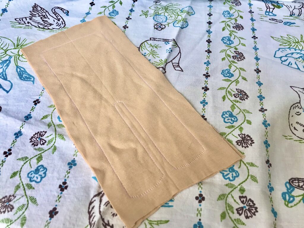 stitched tan fabric on a tablecloth