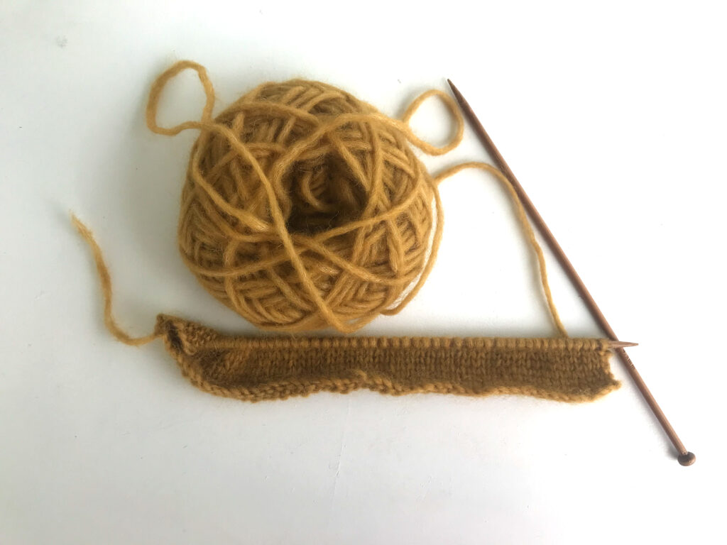 wooden knitting needles knitting mustard yellow bulky yarn