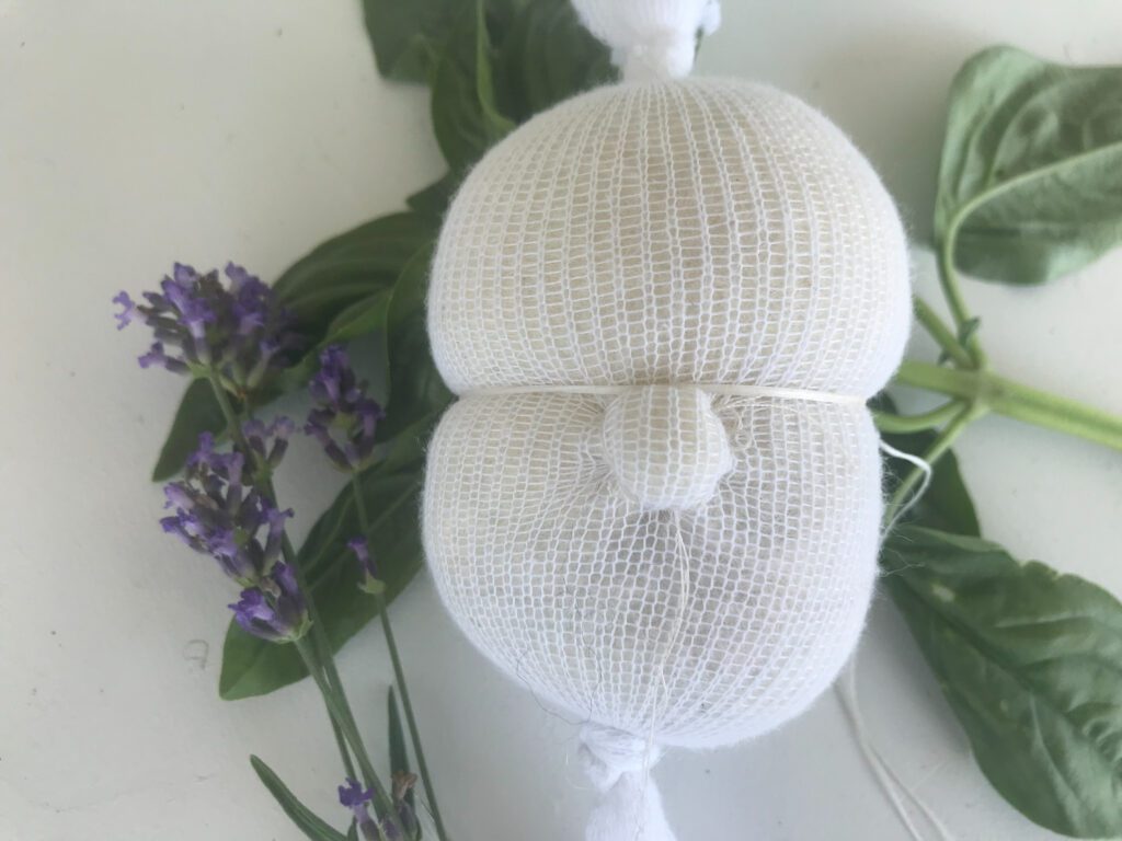 inner waldorf doll head with nose lavender and basil in background