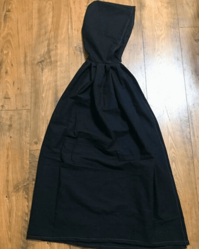 featured image for child's cloak black hooded cloak on wooden floor