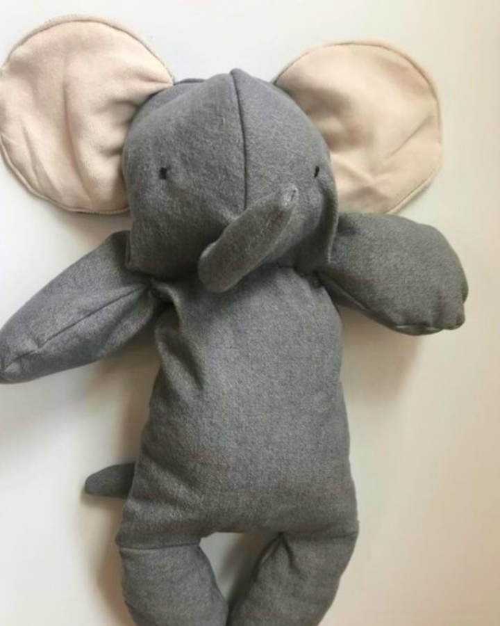 grey stuffed elephant on white background