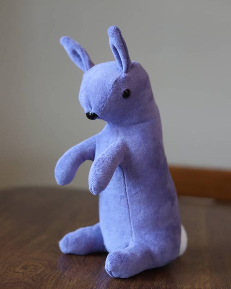 handmade purple velveteen rabbit on a brown table