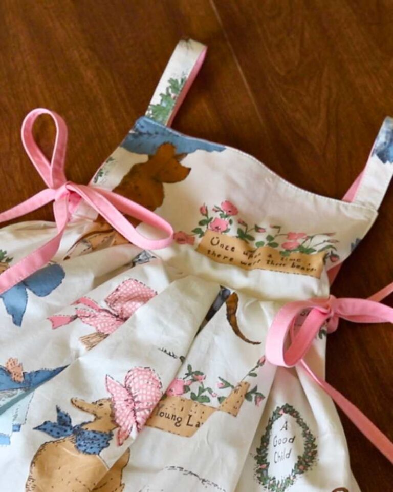 handmade pinafore apron with storybook fabric